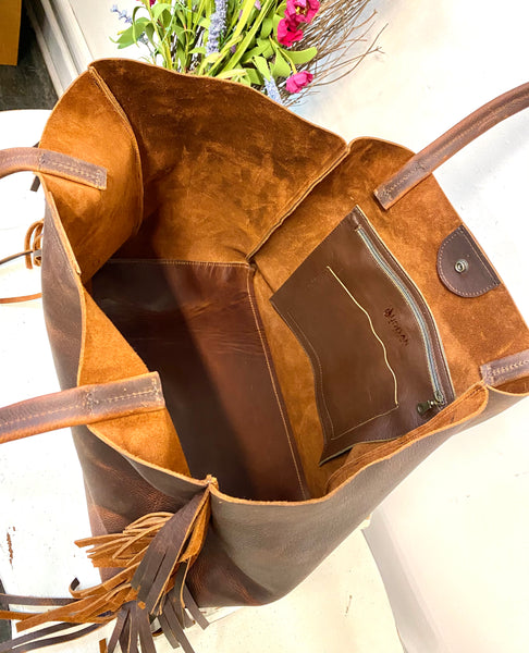 Vintage brown leather tote with side fringe